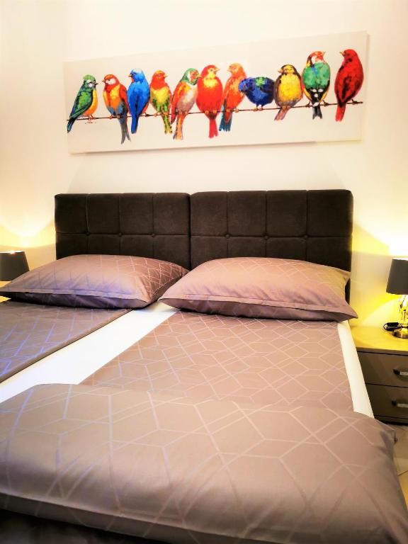 Łóżko lub łóżka w pokoju w obiekcie Apartments Petar Pan