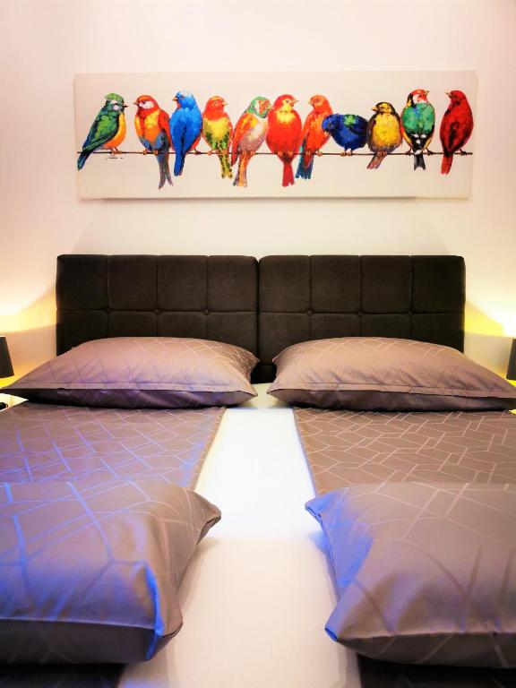 Łóżko lub łóżka w pokoju w obiekcie Apartments Petar Pan