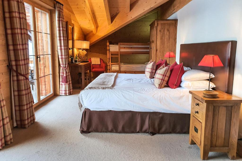 Postel nebo postele na pokoji v ubytování Mountain Lodge, Les Crosets