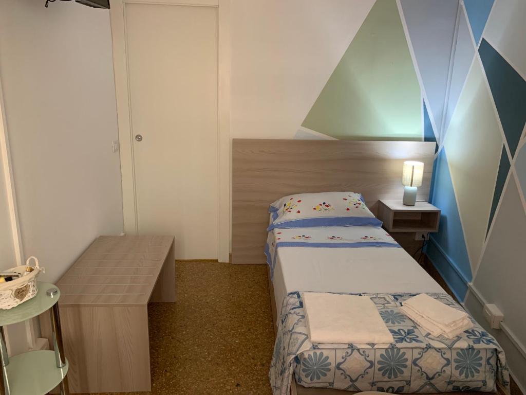 Postel nebo postele na pokoji v ubytování Erythrà Bed and Breakfast