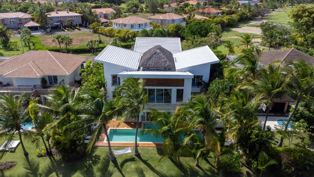 una vista aérea de una casa con palmeras en Luxury Villa Waterfall with Private Pool, BBQ & Maid, en Punta Cana