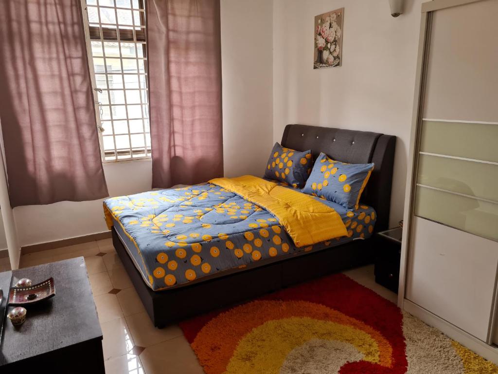 Postel nebo postele na pokoji v ubytování Homestay Haizal Dataran Segar Haizal Guest House
