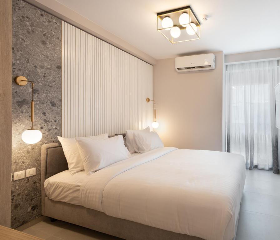 Posteľ alebo postele v izbe v ubytovaní LUX&EASY Athens Downtown Residences