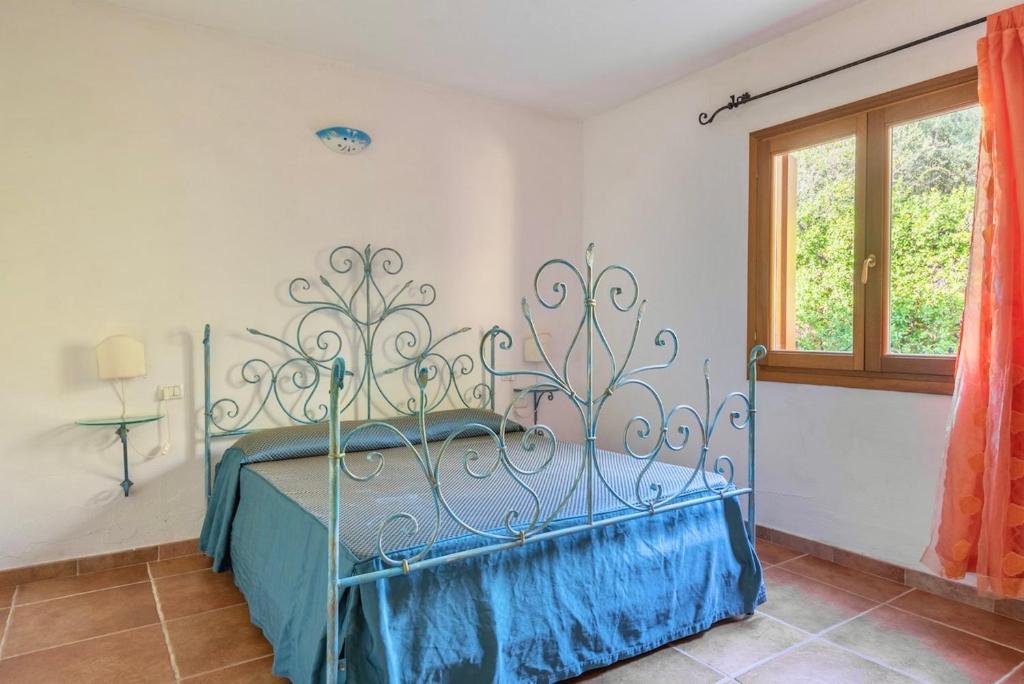 Posteľ alebo postele v izbe v ubytovaní Residence con piscina a Tanaunella a 1500 m dal mare