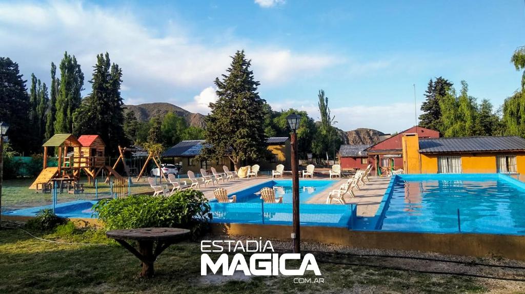 a swimming pool at a resort in the mountains at Cabañas en Valle de Uco in Tunuyán