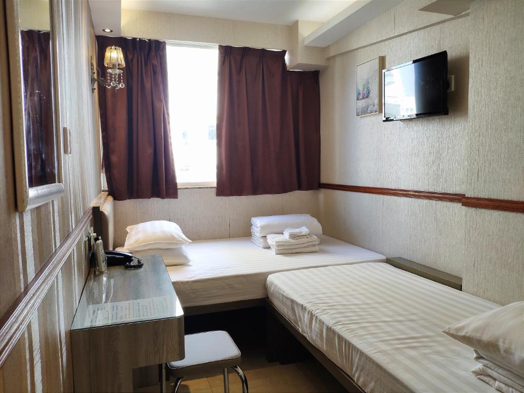 Postel nebo postele na pokoji v ubytování Celltronik Hostel 先創旅店