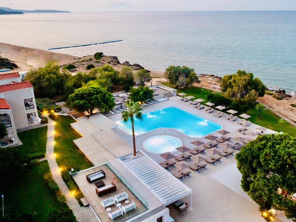 an aerial view of a villa with a swimming pool at The Bay Hotel & Suites in Vasilikos