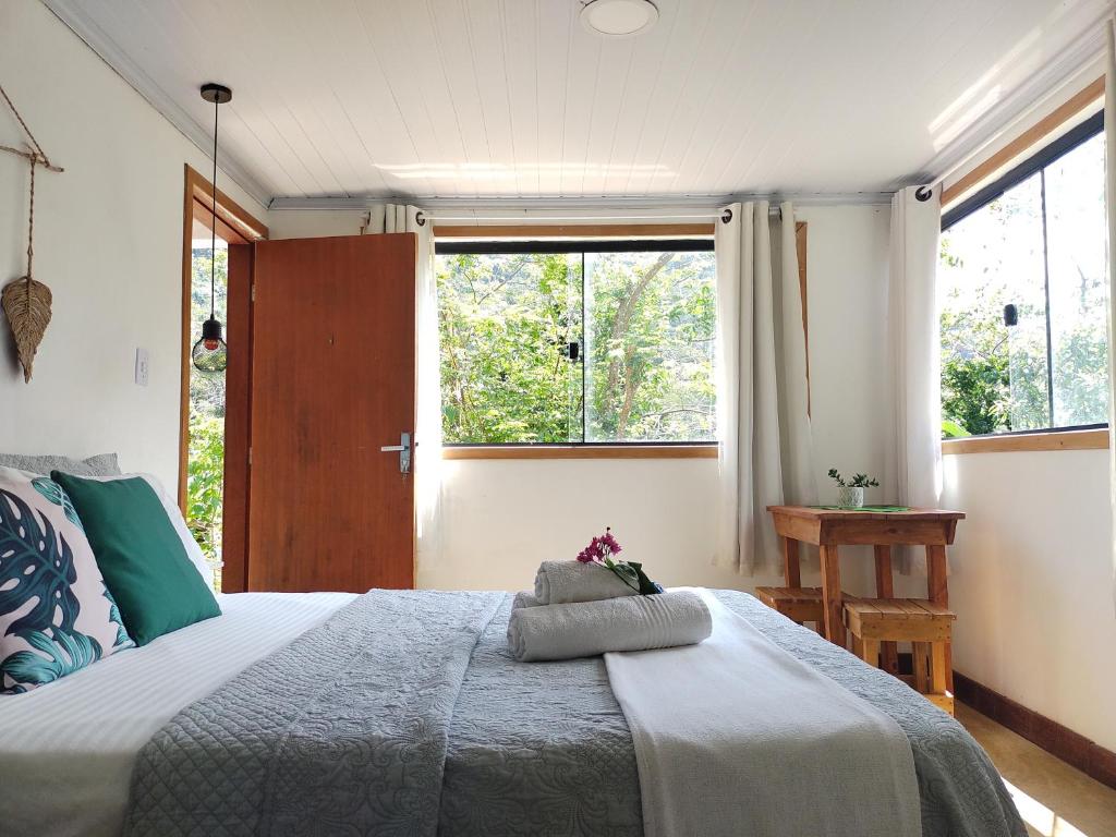Postel nebo postele na pokoji v ubytování Suites casa do indio jungle, a melhor vista da floresta