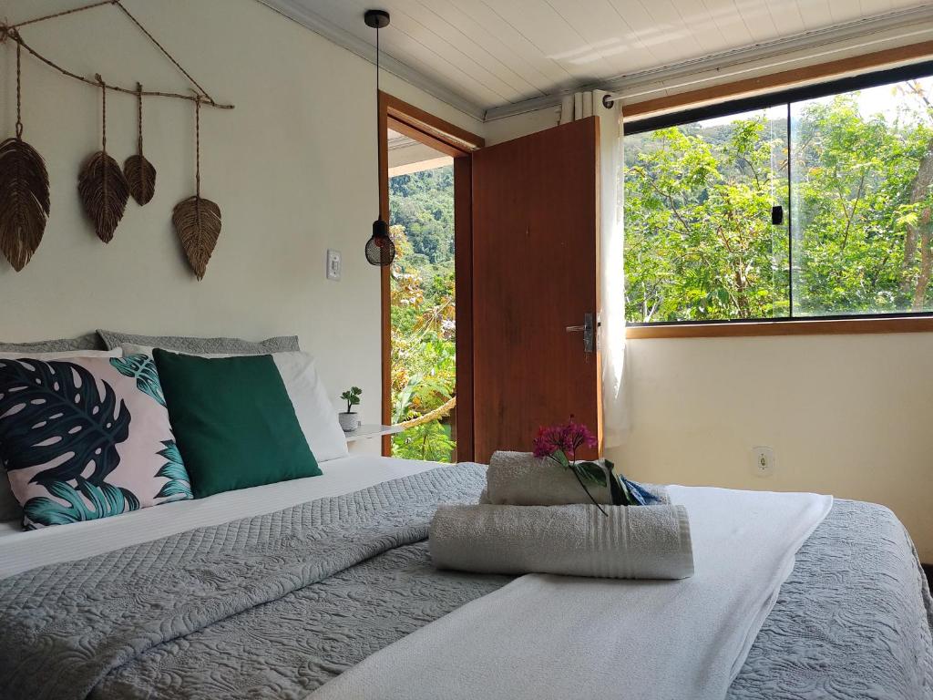 Postel nebo postele na pokoji v ubytování Suites casa do indio jungle, a melhor vista da floresta