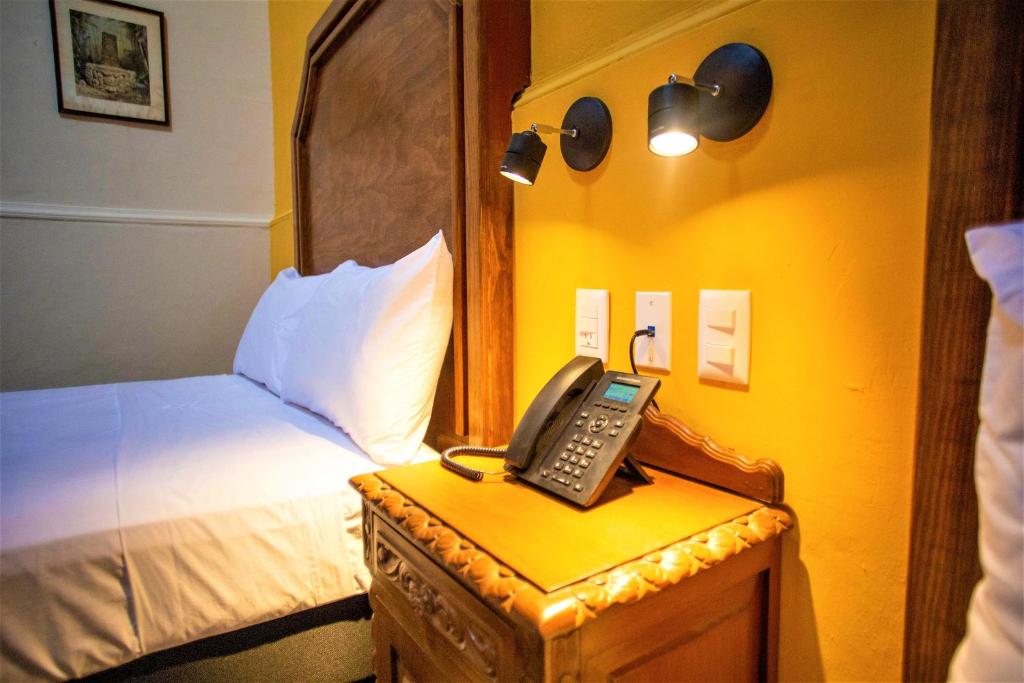Postel nebo postele na pokoji v ubytování Hotel Real Toledo by Kavia