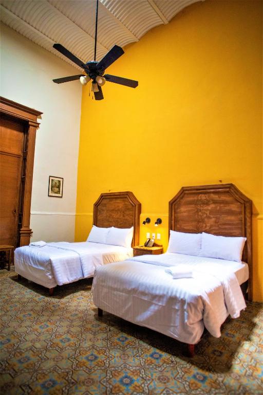 Postel nebo postele na pokoji v ubytování Hotel Real Toledo by Kavia