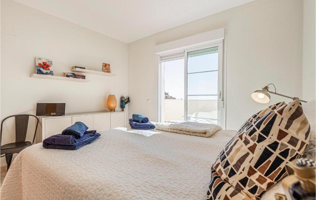 A bed or beds in a room at Gorgeous Apartment In Benalmádena