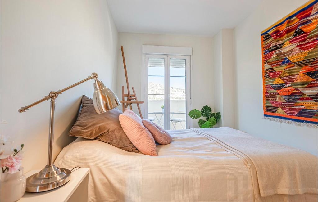 A bed or beds in a room at Gorgeous Apartment In Benalmádena