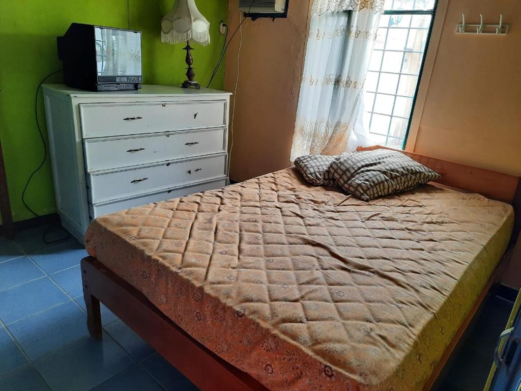 Postel nebo postele na pokoji v ubytování Villas Karen