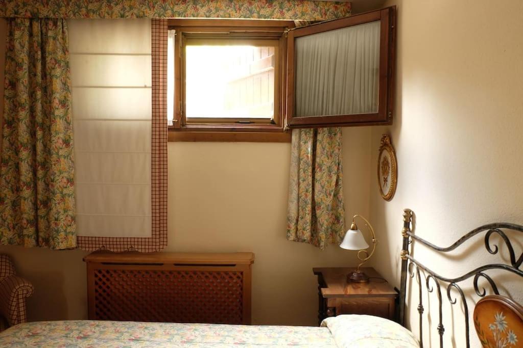Postel nebo postele na pokoji v ubytování Casa rústica familiar en los Pirineos