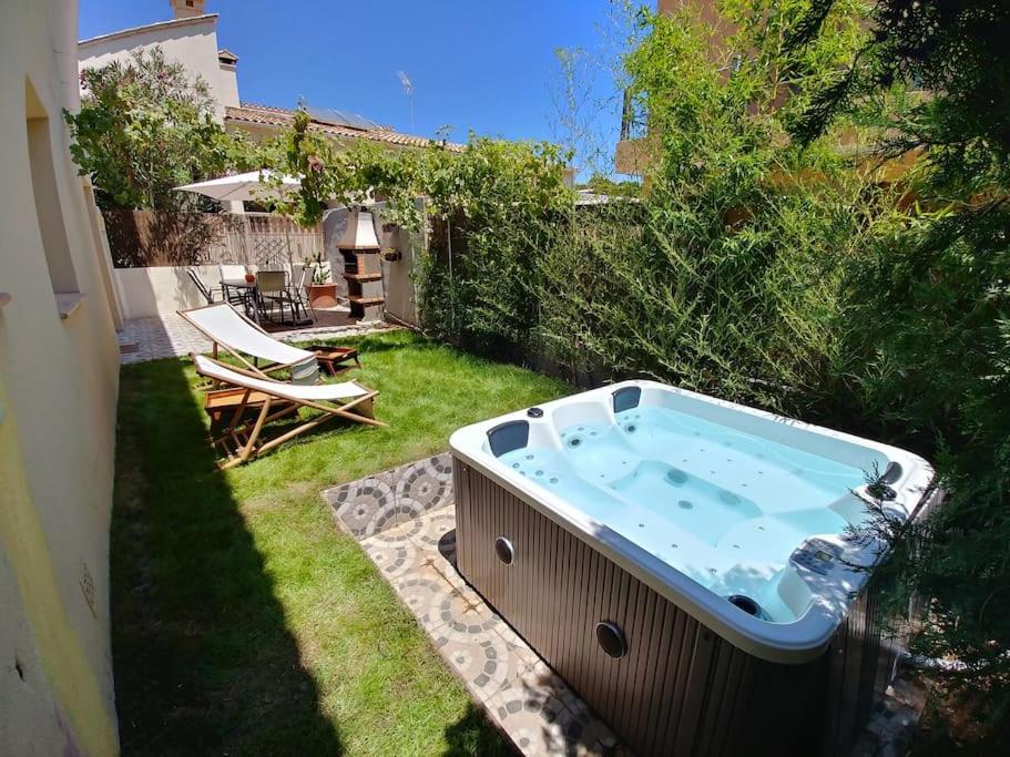 a hot tub in the yard of a backyard at El Rincón, peace at the sea, with jacuzzi in Cala Ratjada