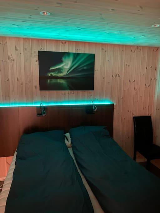 Postel nebo postele na pokoji v ubytování Fjelltun Lodge