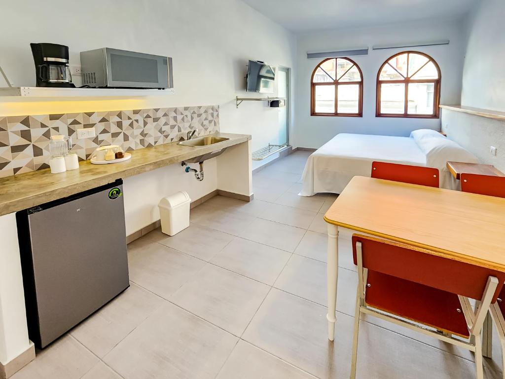 Kuchyň nebo kuchyňský kout v ubytování Niebla Suites