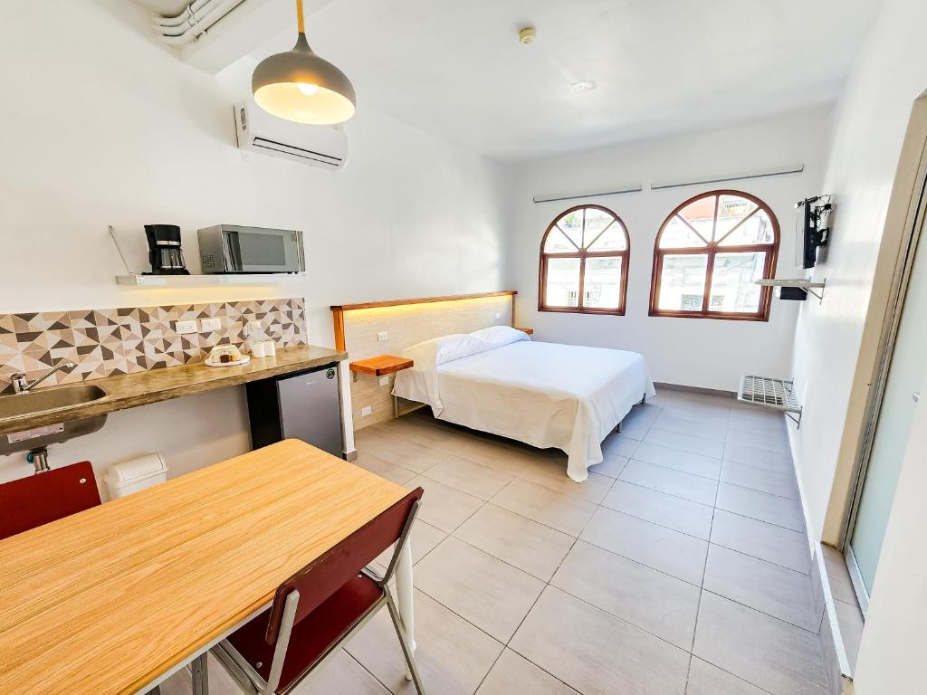 Postel nebo postele na pokoji v ubytování Niebla Suites