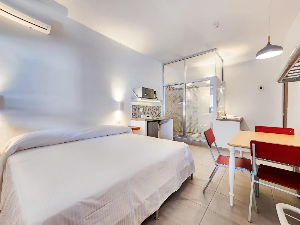 Kuchyň nebo kuchyňský kout v ubytování Niebla Suites