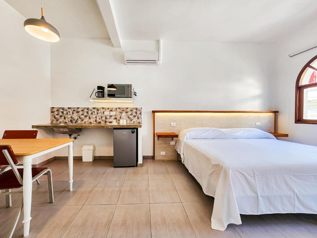 Postel nebo postele na pokoji v ubytování Niebla Suites