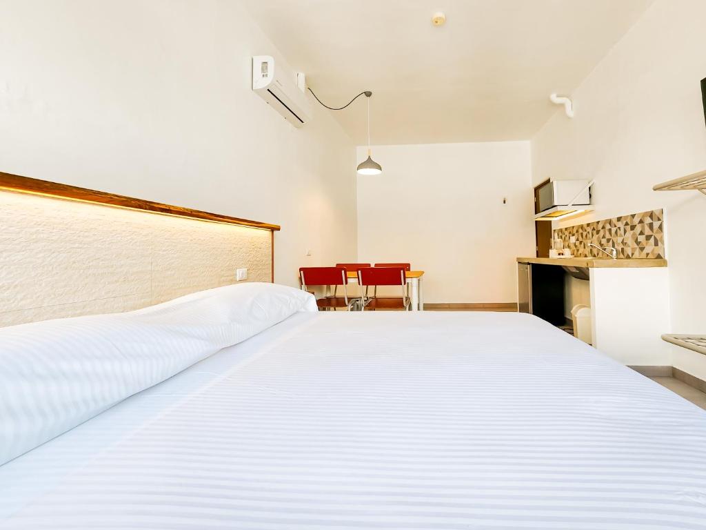 Postel nebo postele na pokoji v ubytování Niebla Suites