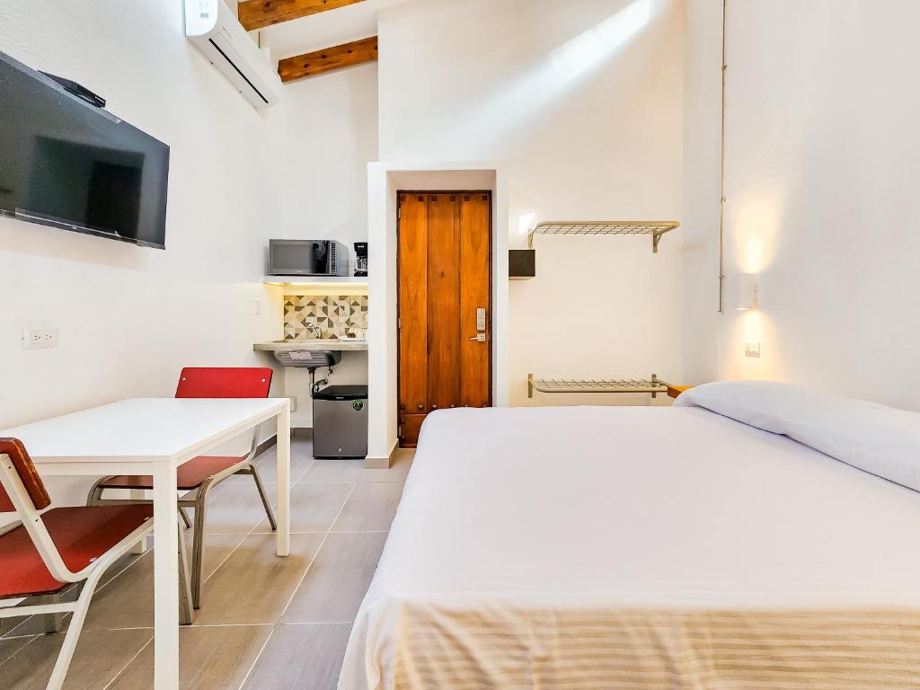 Postel nebo postele na pokoji v ubytování Niebla Suites