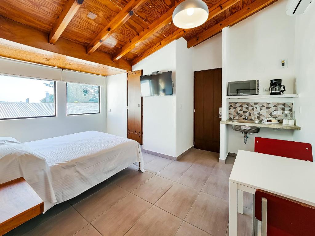Kuchyň nebo kuchyňský kout v ubytování Niebla Suites