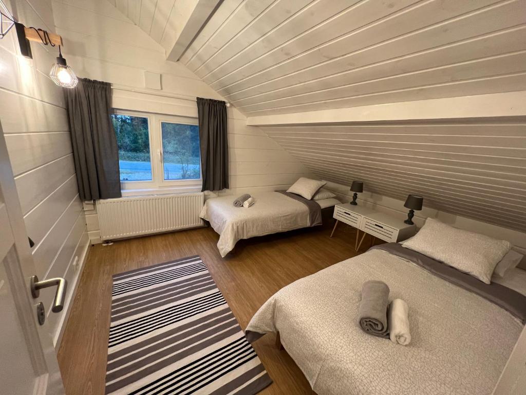 Postel nebo postele na pokoji v ubytování Jõiste Beach Villa