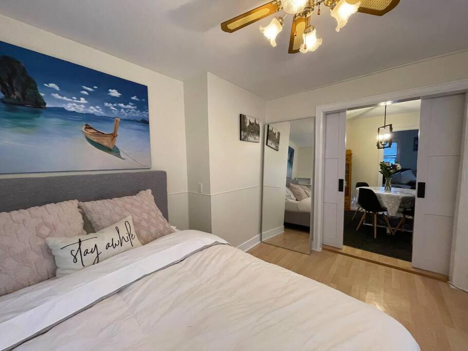 a bedroom with a bed and a view of a bathroom at Little Yellow House In The Heart Of The Valley in Port Williams