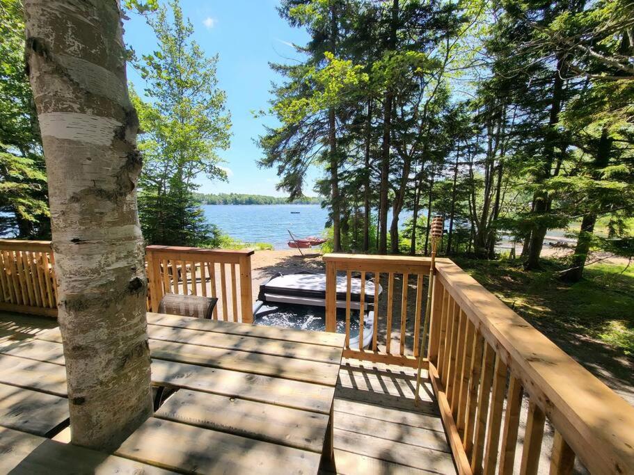 a wooden deck with a view of the water at Leland’s Lakehouse in Wolfville