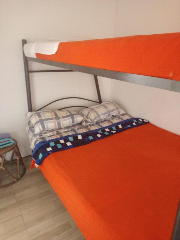 Postel nebo postele na pokoji v ubytování Hostal Cafe San Bernabe