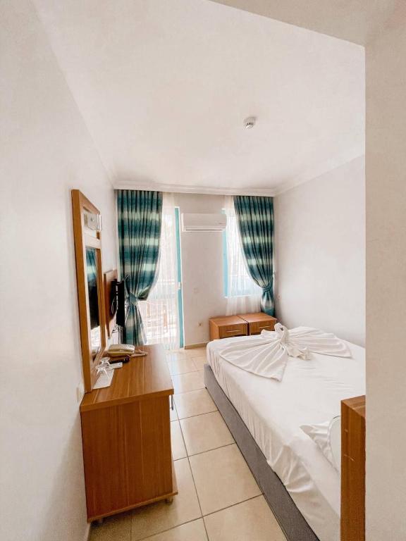 Postel nebo postele na pokoji v ubytování Wonder Life Hotel
