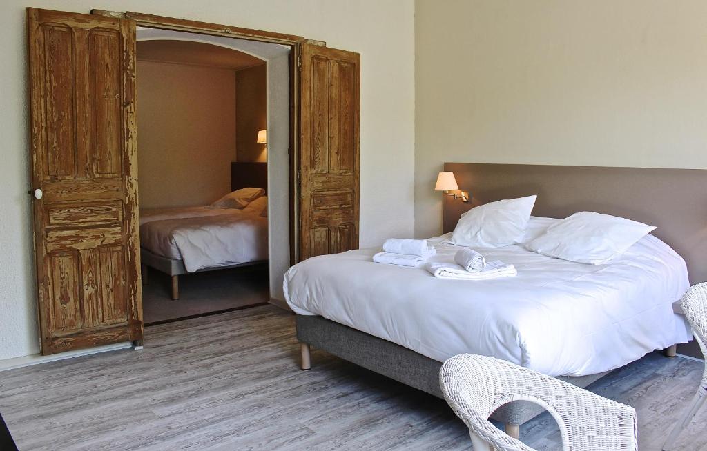 Postel nebo postele na pokoji v ubytování Hôtel de Vacances de la Vignasse