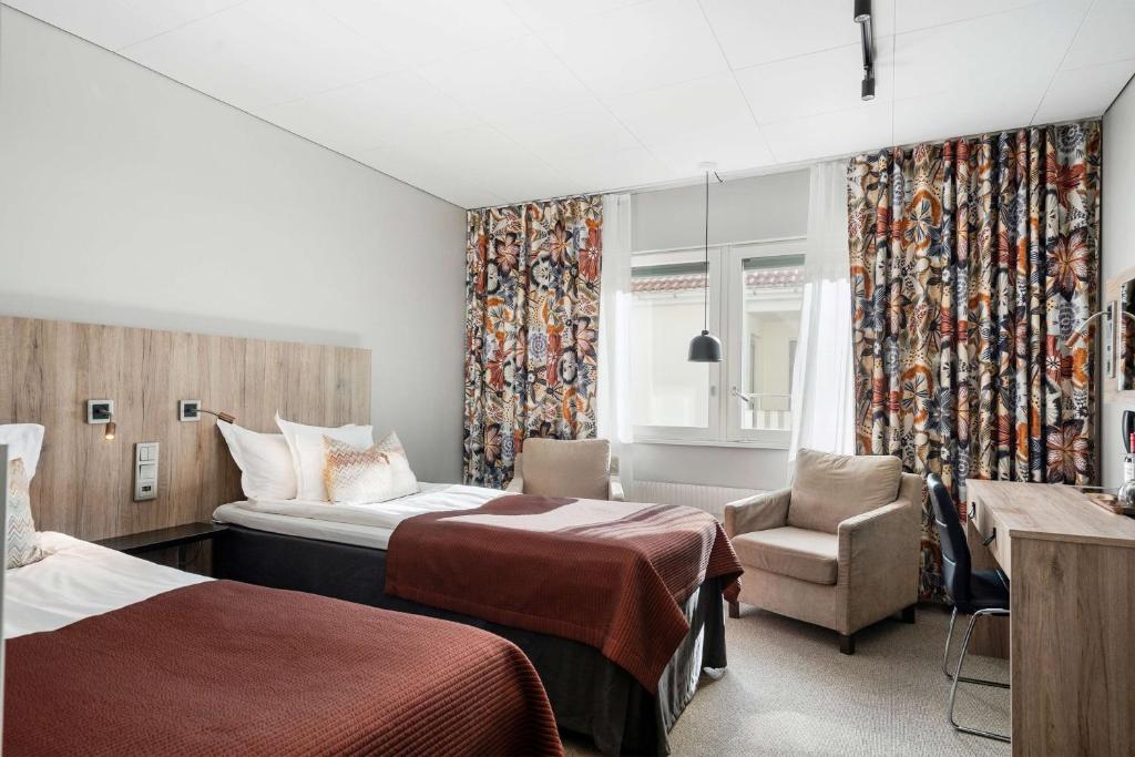 Postel nebo postele na pokoji v ubytování Best Western Plus John Bauer Hotel