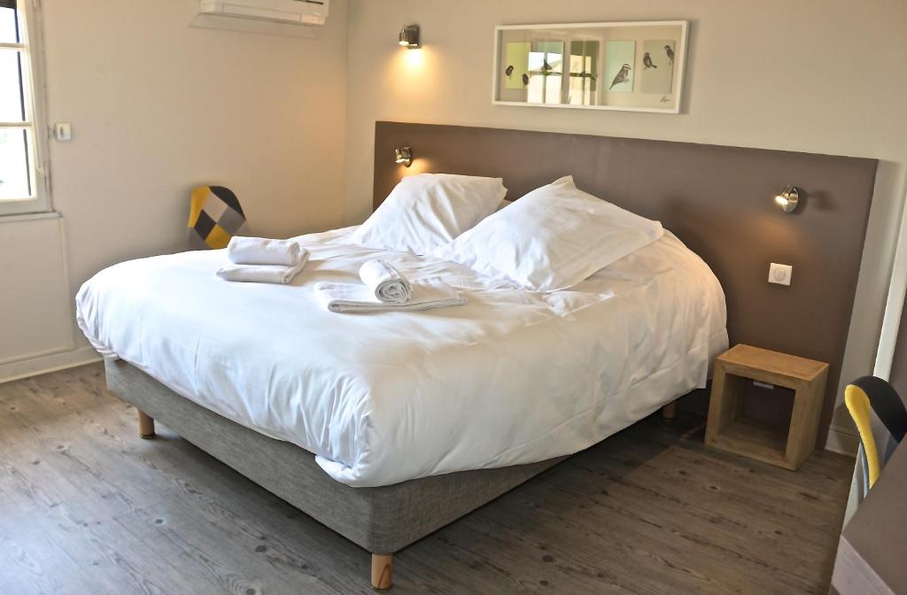 Postel nebo postele na pokoji v ubytování Hôtel de Vacances de la Vignasse