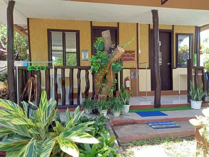 a house with plants in front of it at Ennas Place in Coron