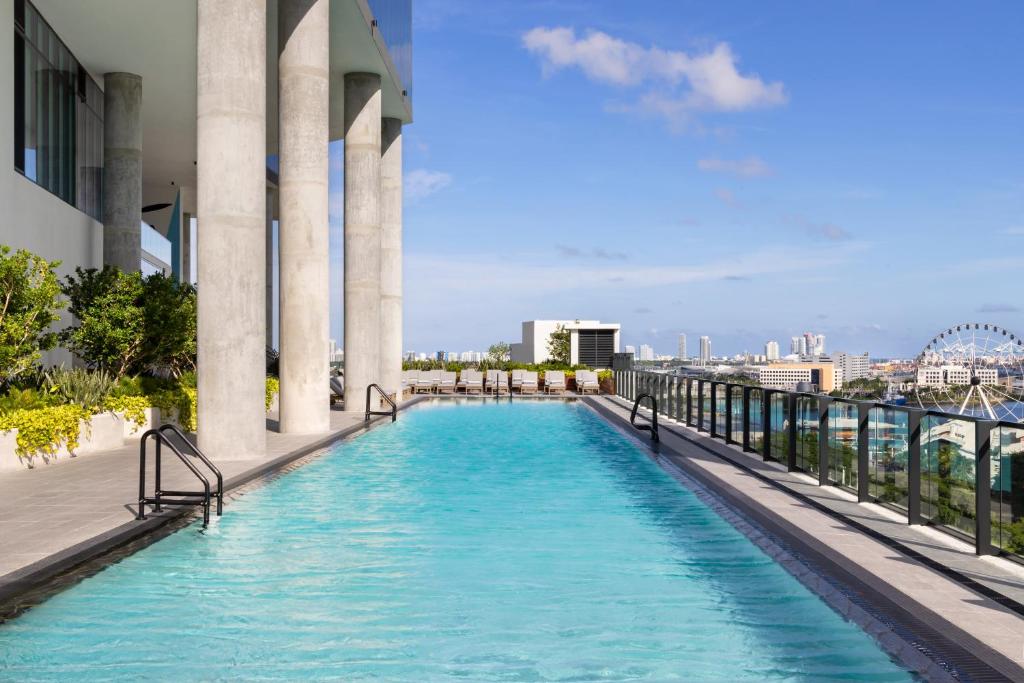 a swimming pool on the roof of a building at The Elser Hotel Miami in Miami