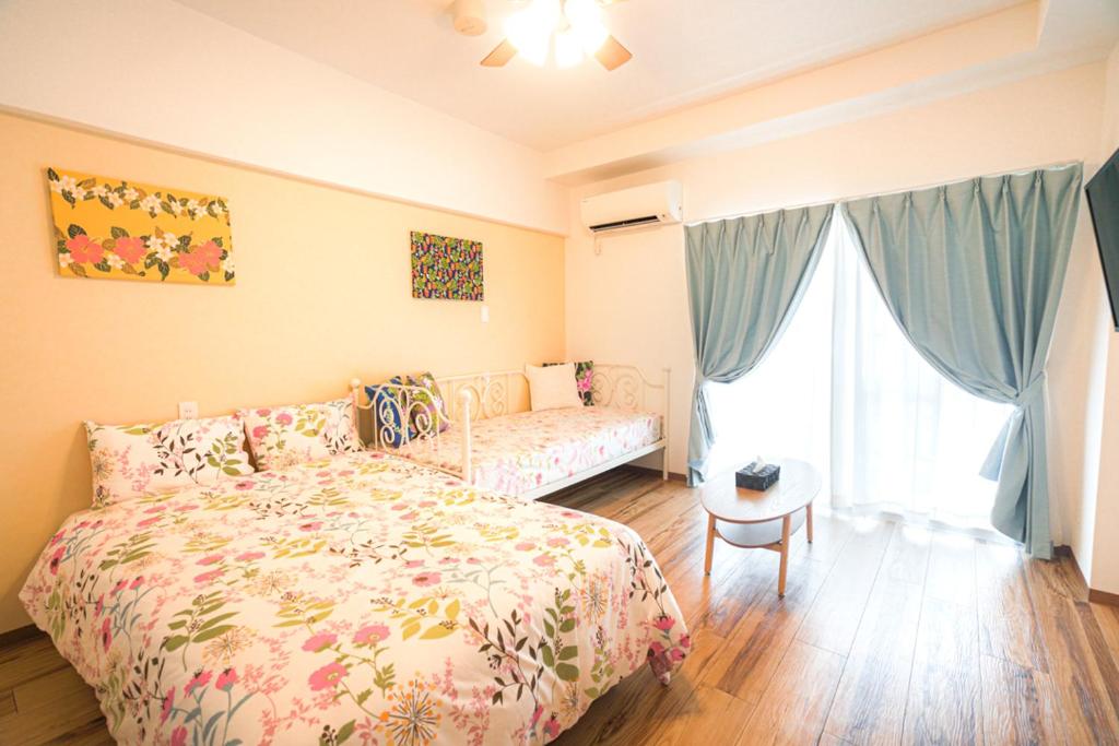Postel nebo postele na pokoji v ubytování HOTEL HOUKLEA