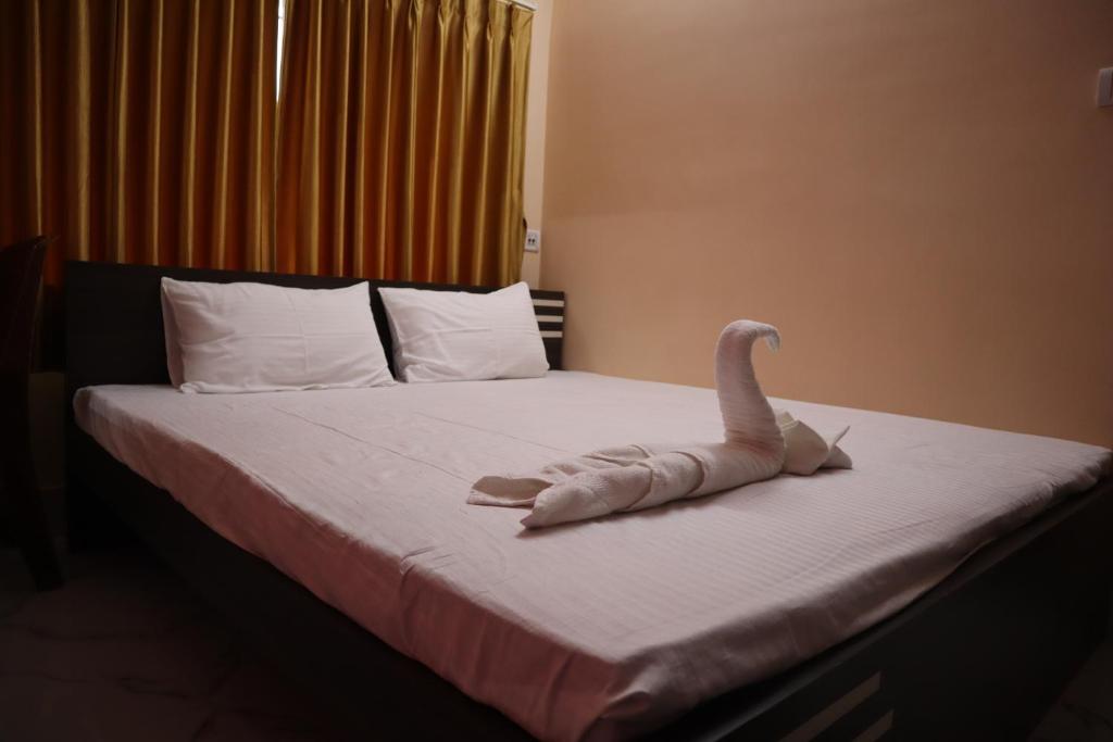 Postel nebo postele na pokoji v ubytování Hotel Saan Berhampore