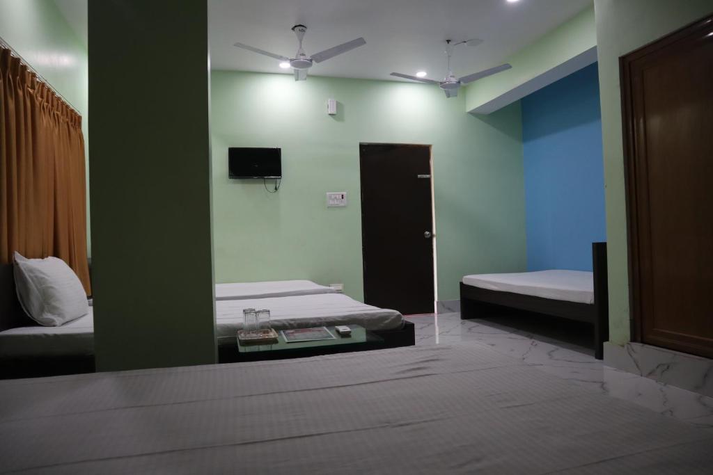 Postel nebo postele na pokoji v ubytování Hotel Saan Berhampore