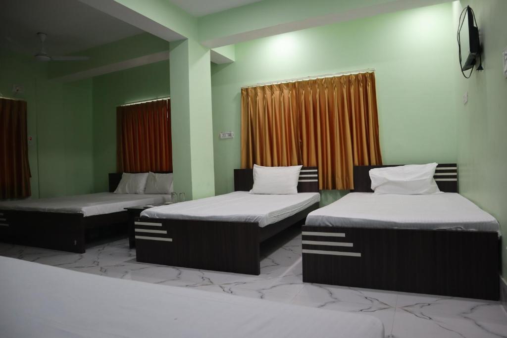 Postel nebo postele na pokoji v ubytování Hotel Saan Berhampore