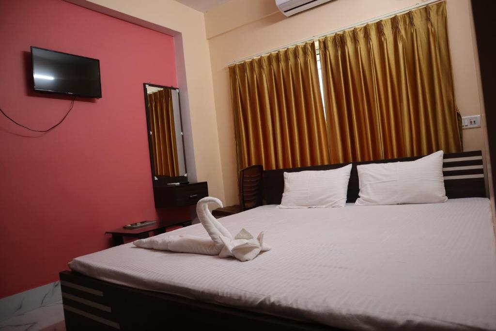Postel nebo postele na pokoji v ubytování Hotel Saan Berhampore