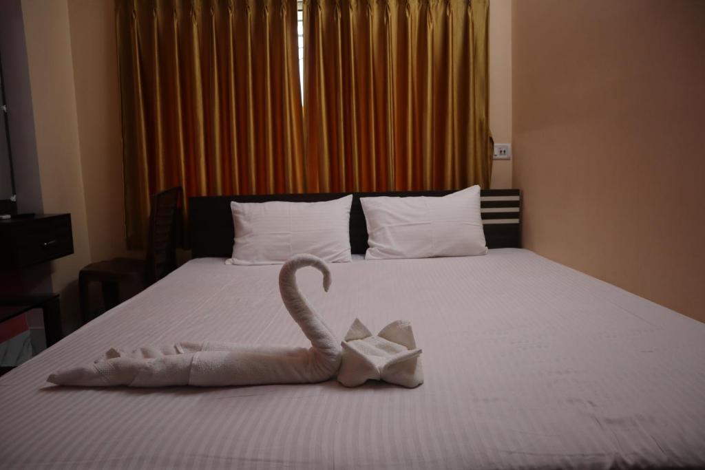 Postel nebo postele na pokoji v ubytování Hotel Saan Berhampore