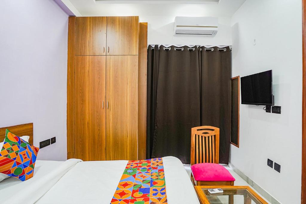 Postel nebo postele na pokoji v ubytování FabHotel Sunrise Sector 56