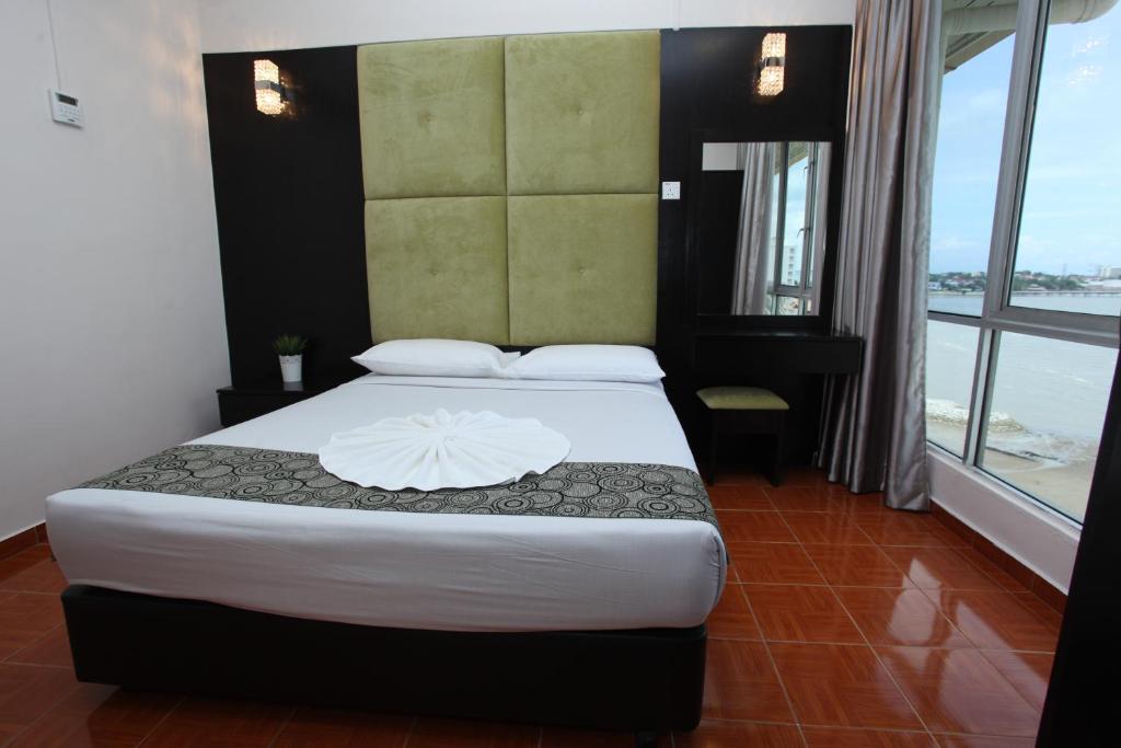 Postel nebo postele na pokoji v ubytování Glory Beach Resort