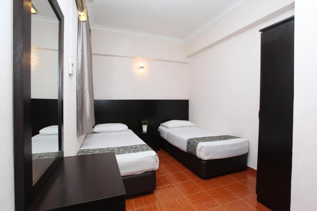 Postel nebo postele na pokoji v ubytování Glory Beach Resort