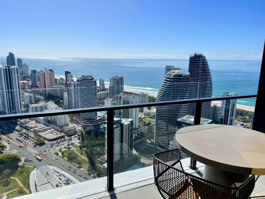 a balcony with a view of the city and the ocean at Broadbeach Luxury OceanView 2beds apartment 49F in Gold Coast