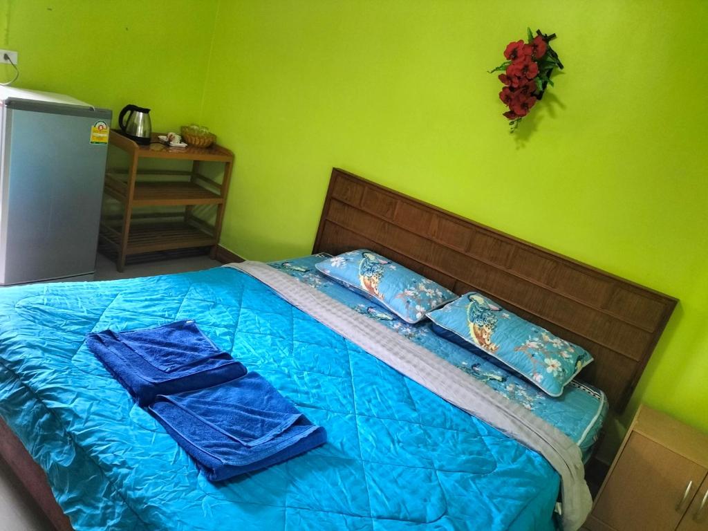 Postel nebo postele na pokoji v ubytování Lanta Blue House