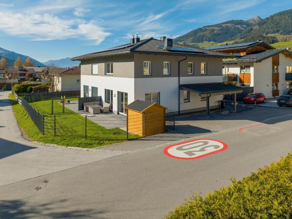 a house with a ping pong table on a street at Holiday home in Niedernsill near ski area in Niedernsill